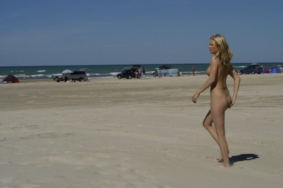 Swedish blond teen having fun on the beach