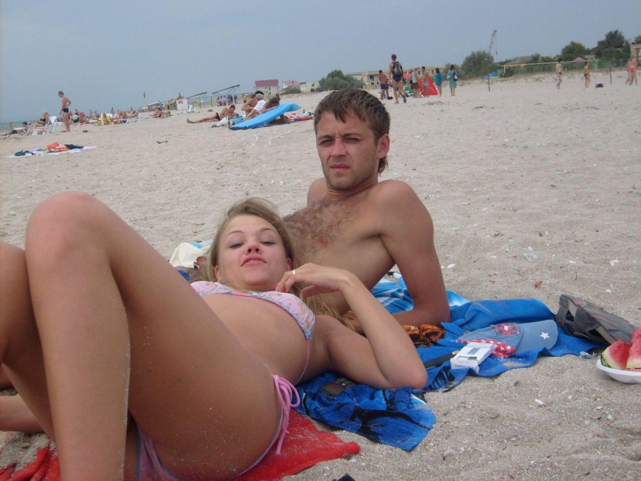 Young russian couple showing holiday pics 