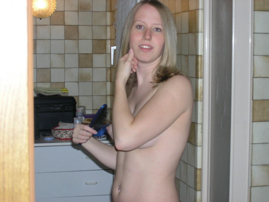 Young blond girl in bathroom