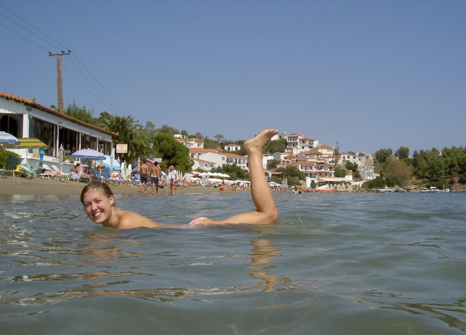 Teen blond girl on holiday  at the beach