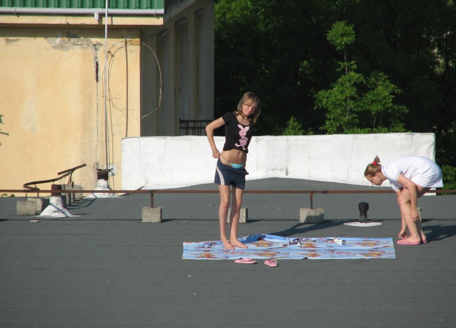 Teens sunbathing in the roof ( voyeur )