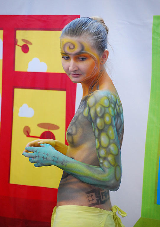 Amateur nudists and theirs beach body painting