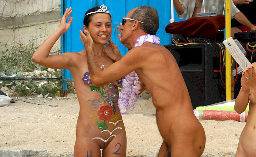 Amateur nudists and theirs beach body painting