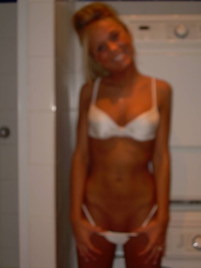 Hot blonde self-shots her small pussy