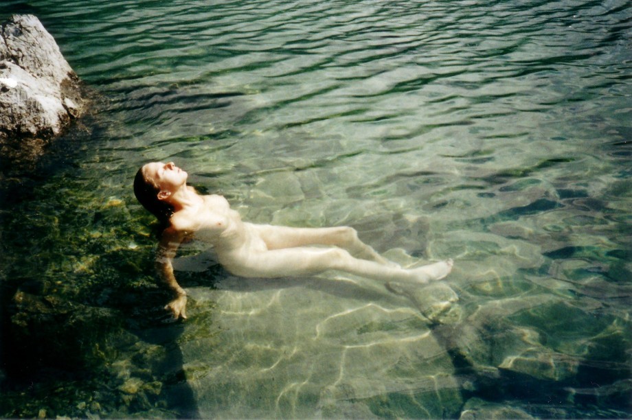 Blond girl and her holiday pics at the river