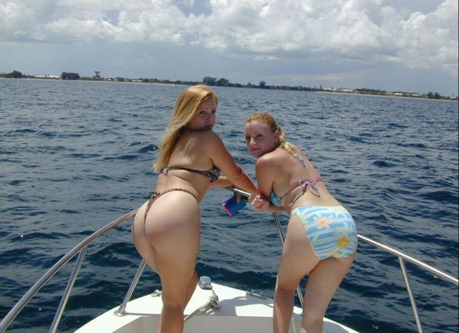 Two shaved girls on a boat 