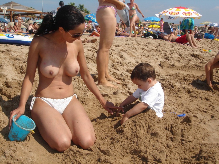 Brunette amateur with big boobs at beach 