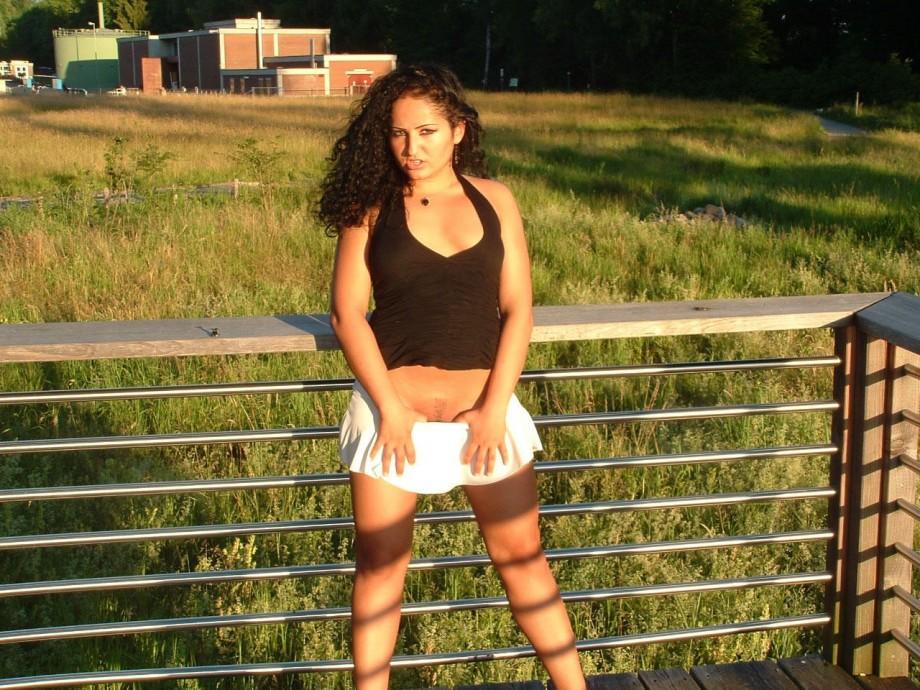 Latina posing outdoors