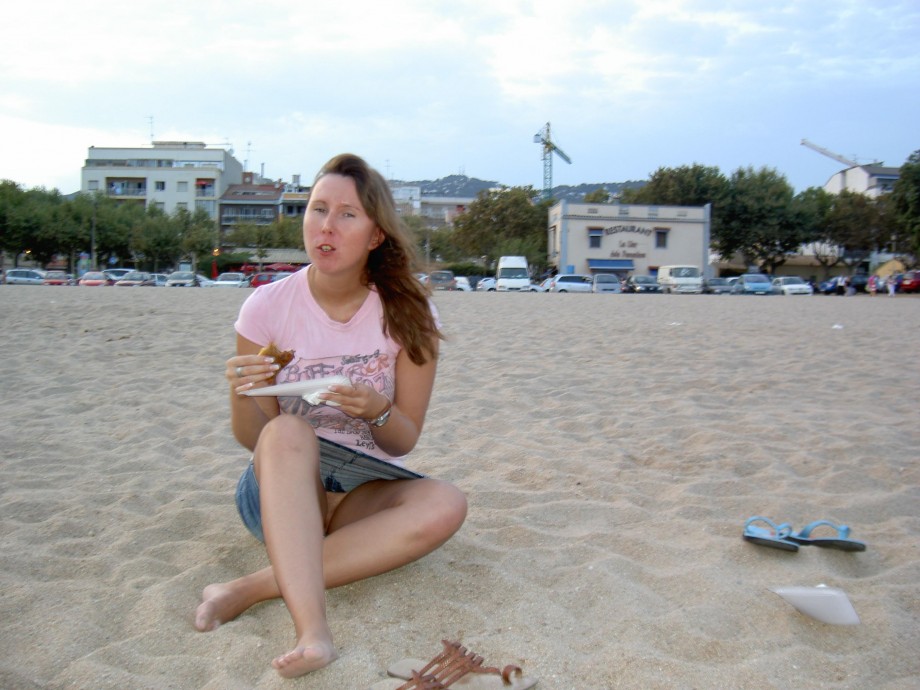 Sexy brunette with big boobs on beach holiday