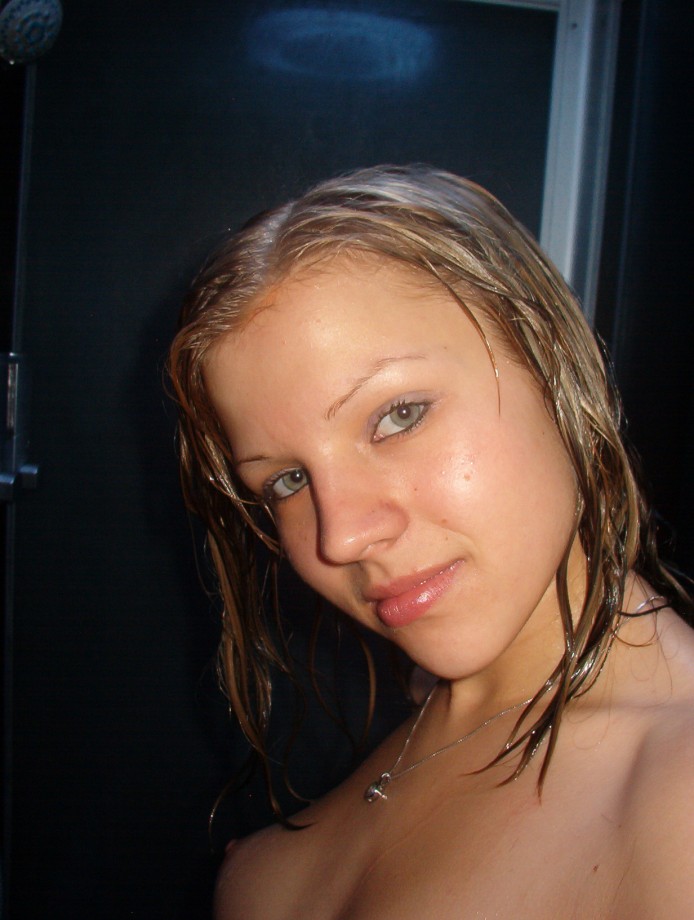 Hot blonde masturbates in the shower