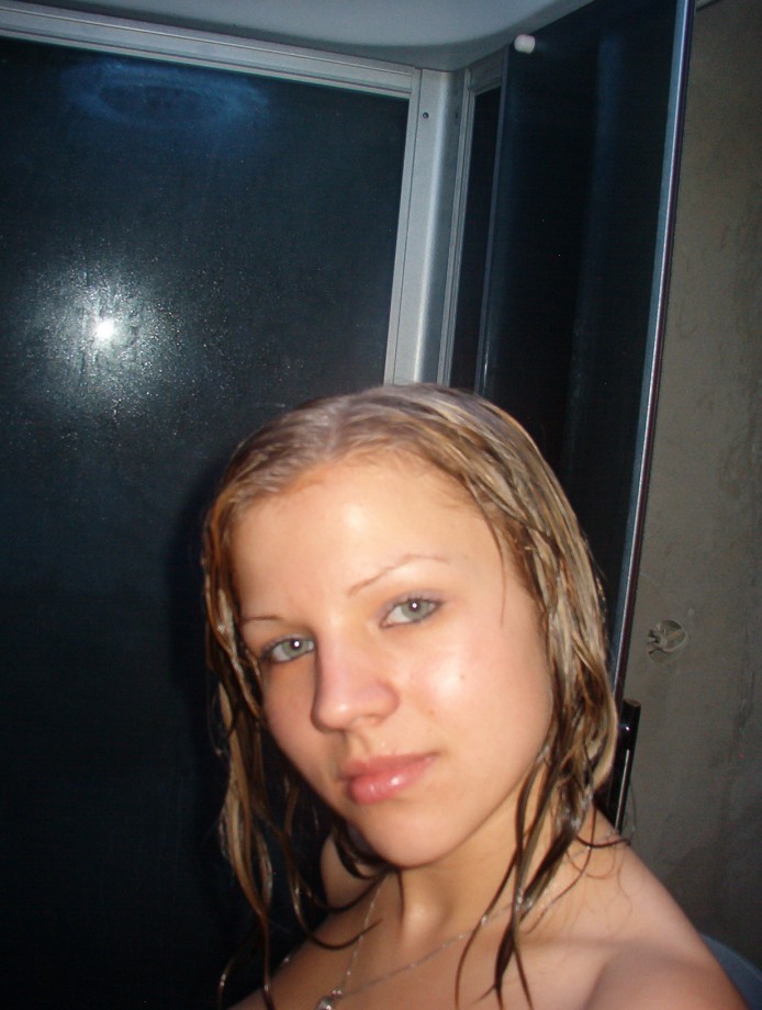 Hot blonde masturbates in the shower