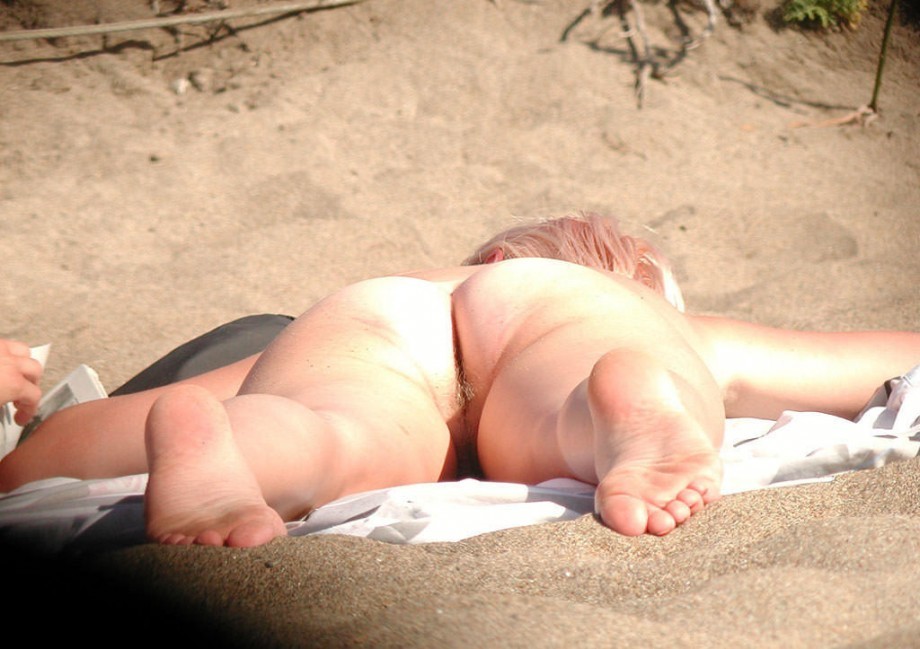 Cute blonde with a hairy pussy on the beach