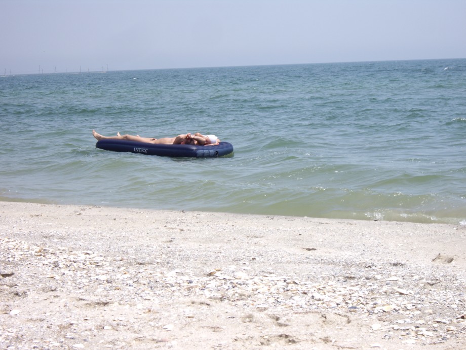 Licking lesbians on beach