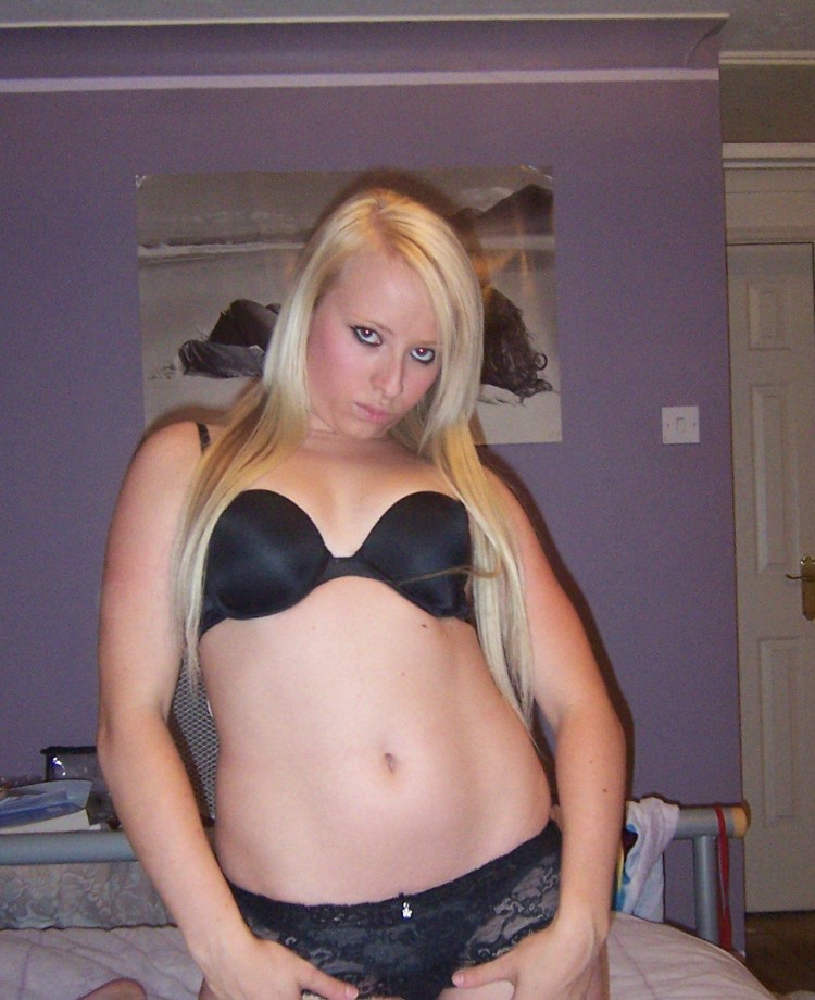 Selfshot blond in purple room