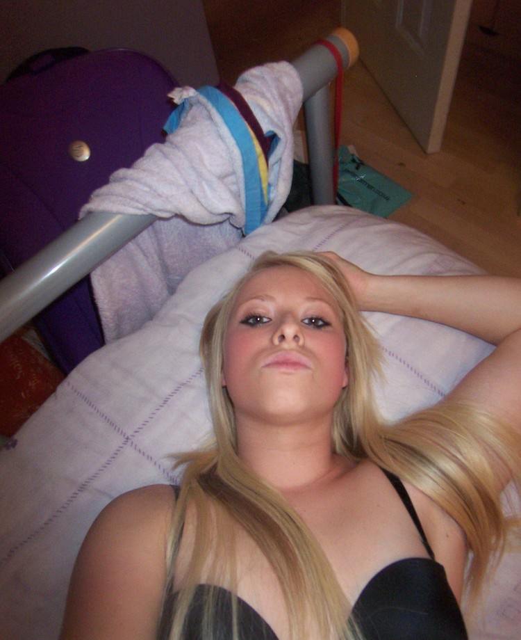 Selfshot blond in purple room