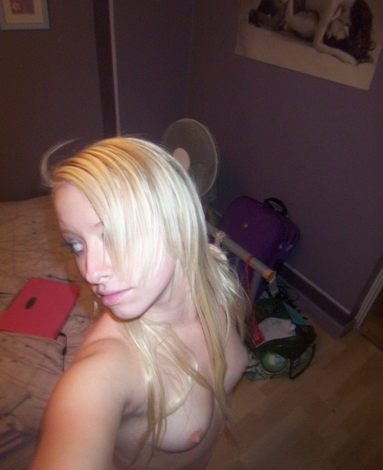 Selfshot blond in purple room