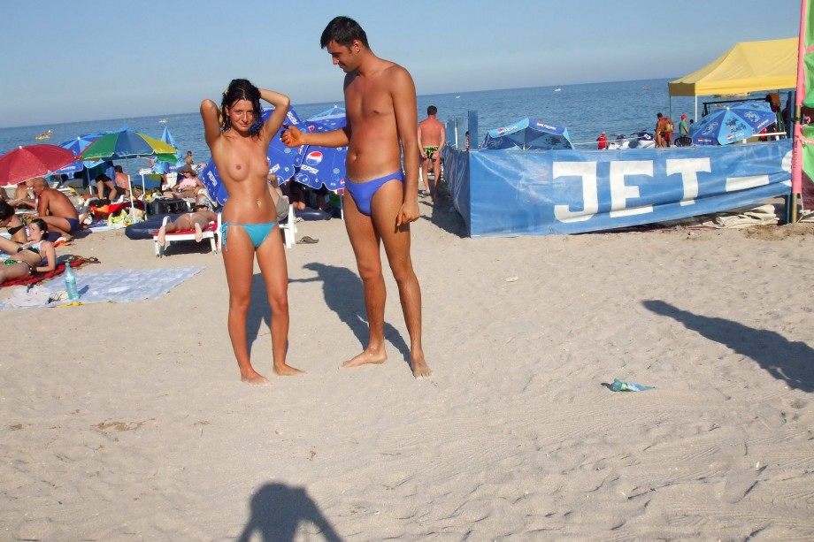 Topless girlfriend on the beach