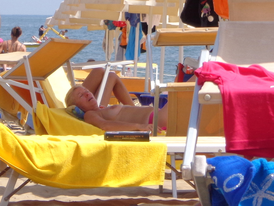 Girls sunbathing on italian beach of the adriatic coast