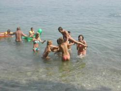 7 girls topless group shot on the beach  6/19