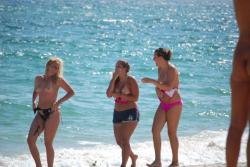 7 girls topless group shot on the beach  13/19